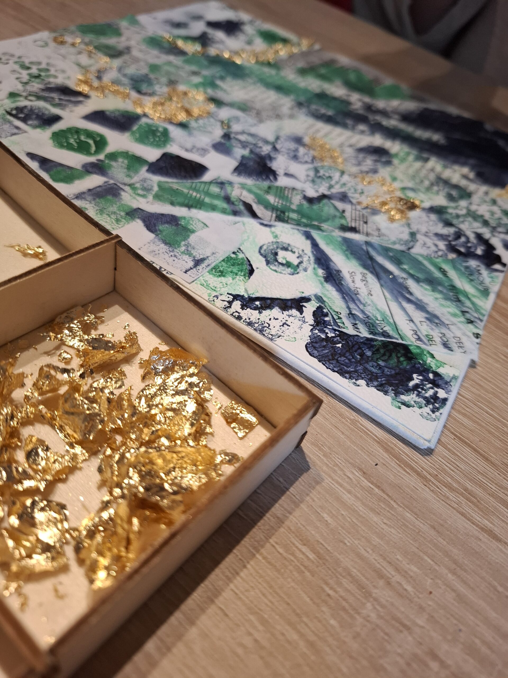 Creative art canvas textured green and gold with metal sheets in boxes, illustration of the workshop discovery creative art.